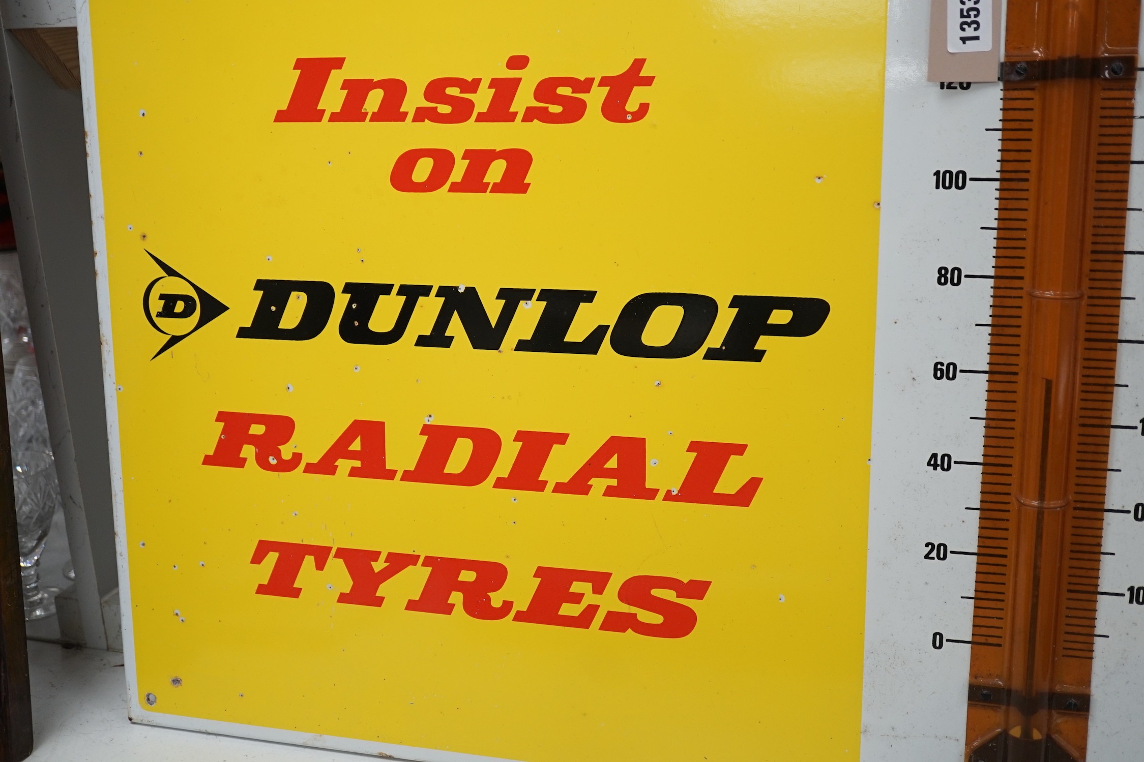 An enamel sign, Insist on Dunlop Radial Tyres, 66.5cms wide x 51cms high